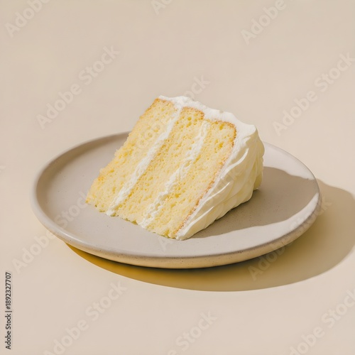 Slice of Layered Sponge Cake with Cream Frosting