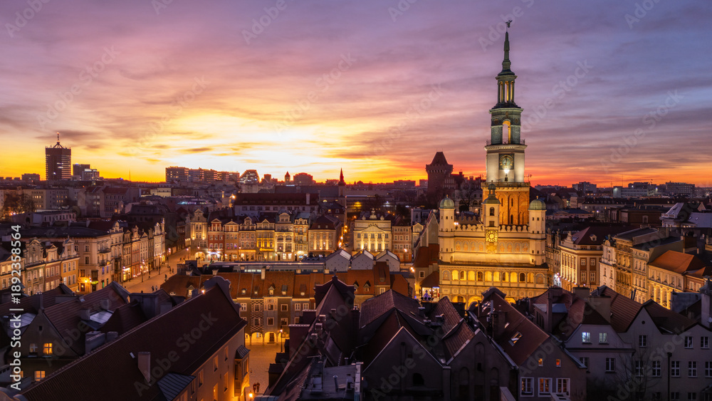 Fototapeta premium 5 march 2025, Poznan, Poland. Aerial, drone view during sunset, twilight, on the old market square, Stare Rynek town in the city centre of Poznan, Poland. Warm golden light. Wonderful must-see tourist