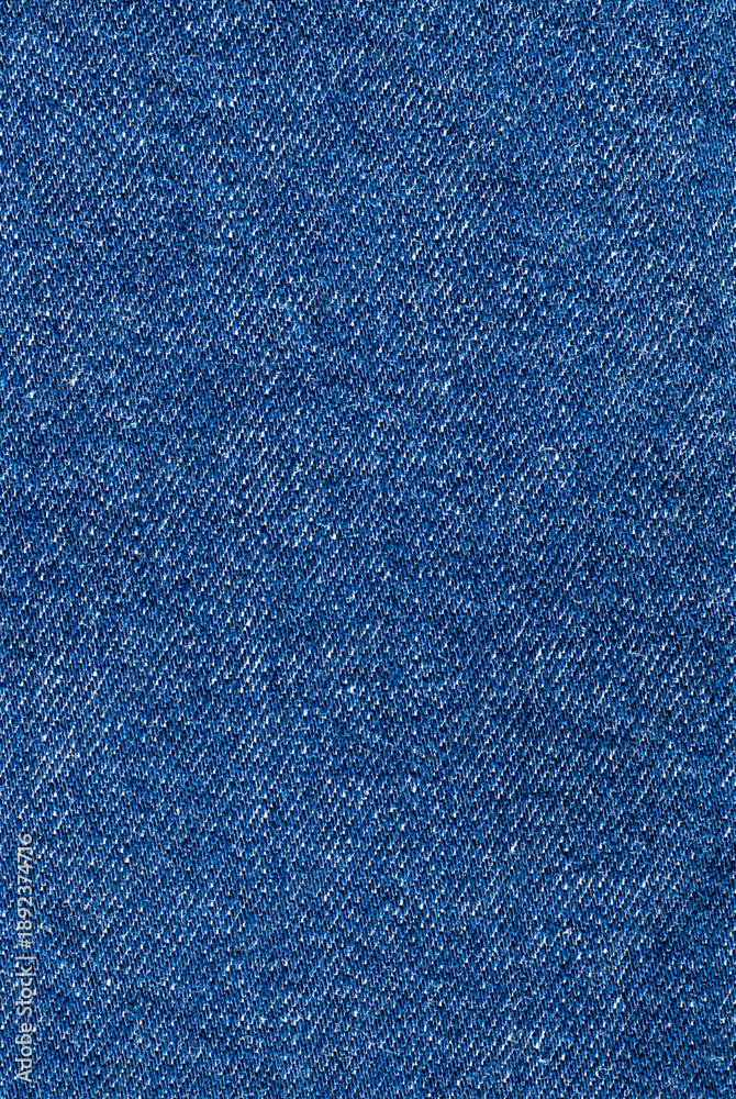Naklejka premium Blue background, denim fabric close-up
