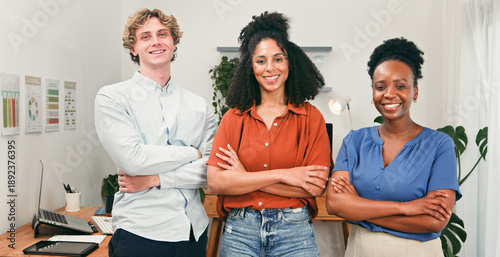 Obraz na plátně Three Confident Colleagues Standing Together in a Modern Office for Teamwork and