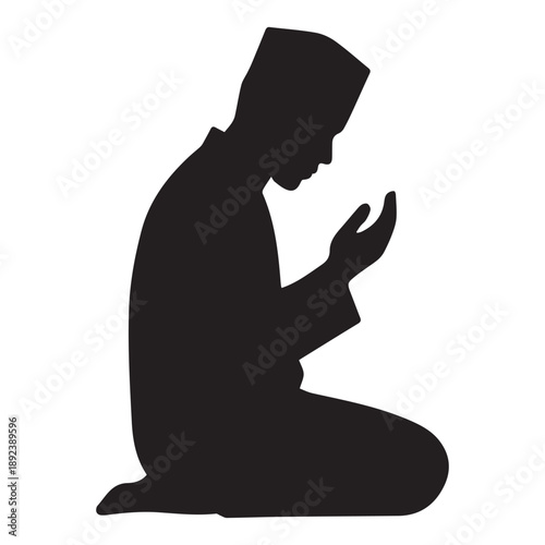 A kneeling man in prayer depicted as a striking silhouette