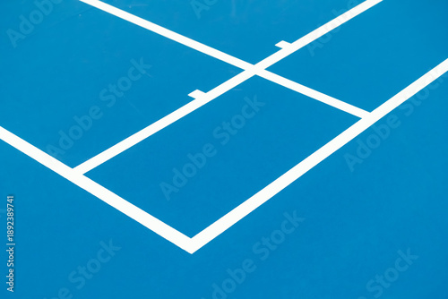 High angle view of white lines on blue hard badmonton court surface