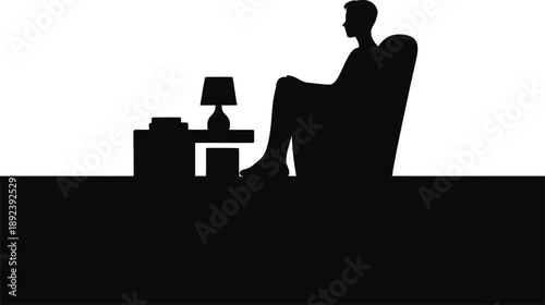 Silhouette Of Man Relaxing In Armchair Indoors