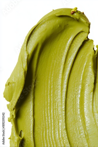 Crema untada de pistacho verde con trozos pequeños, Textura cremosa de pistacho elegante para postre gourmet, Fondo vibrante de crema de pistacho para publicidad de alimentos