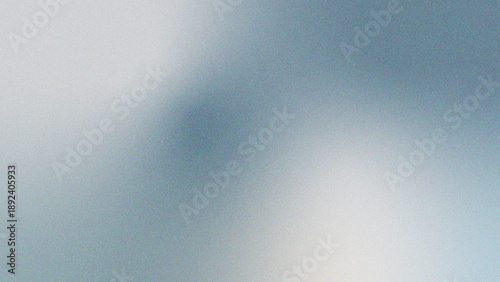 Smooth monochrome surface with subtle grain creates minimalist backdrop, blending soft light transitions and elegant silver tones for contemporary visual projects.