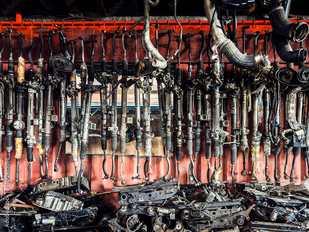 Fototapeta Organized Car Parts and Engines in a Professional Auto Salvage Yard with No any