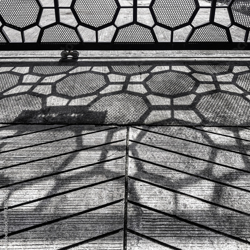 Black and White High Contrast Shadow of Perforated Metal Fence