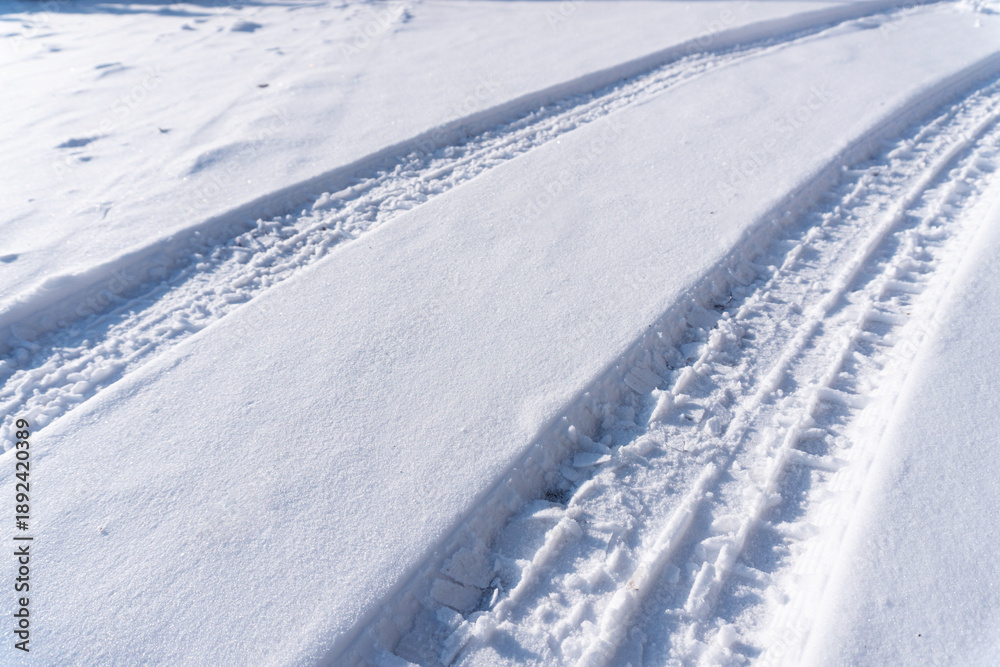 Naklejka premium car tire tracks on the snow