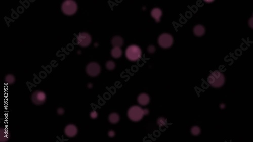 Red Particles Moving Against Black Background.