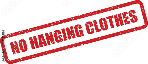 A distinct red rectangular stamp with a grunged appearance says NO HANGING CLOTHES on a bright white surface
