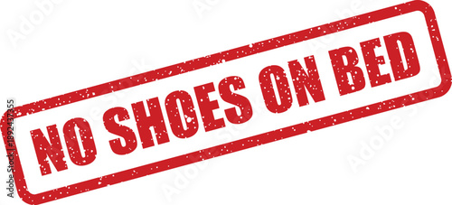 A rectangular red grunge rubber stamp clearly stating the important message No Shoes On Bed