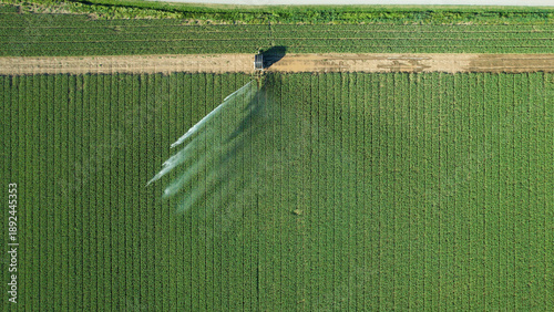 Modern sprinkler irrigation system waters crops in Po Valley, enhancing agricultural resilience