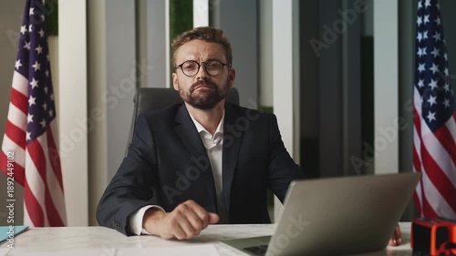 Portrait of male U.S. ambassador working in embassy office, foreign affairs
