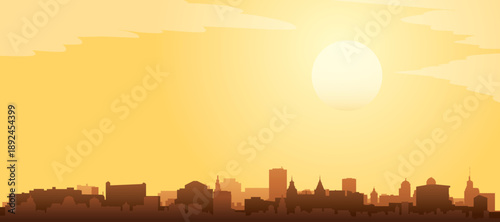 Golden yellow panoramic poster of the city skyline with misty background buildings and clouds of AMSTERDAM, NETHERLANDS