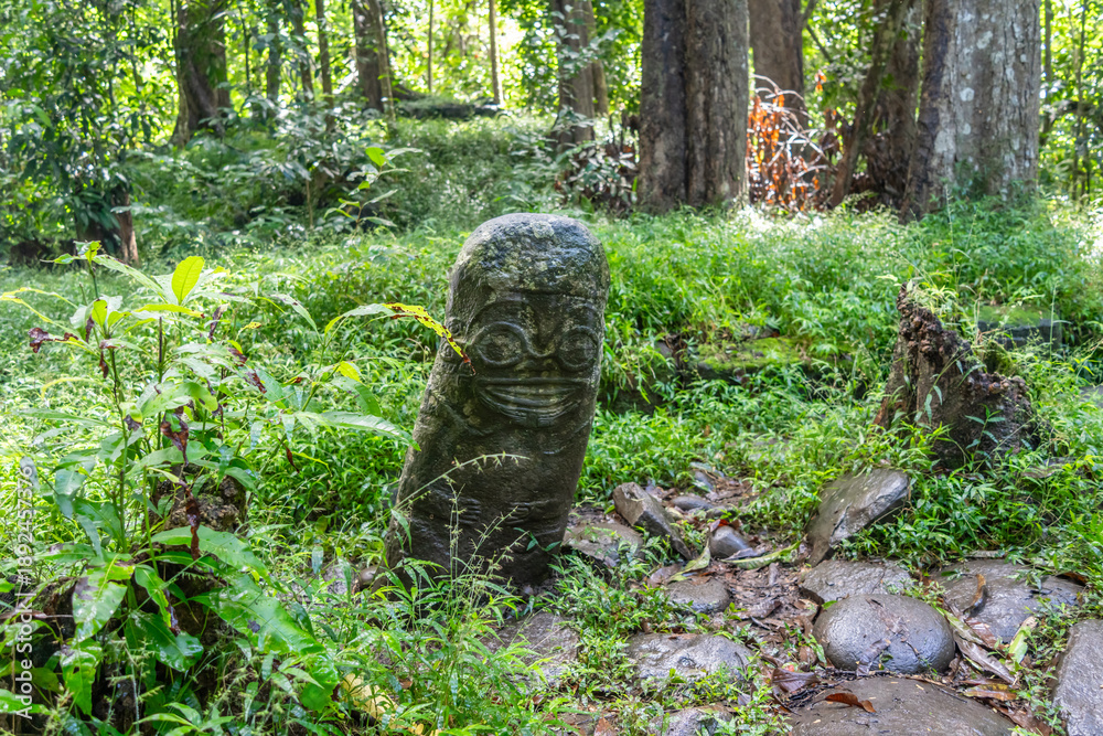 Fototapeta premium Smiling tiki of Punaei in Hiva Oa, Marquesas Islands, French Polynesia