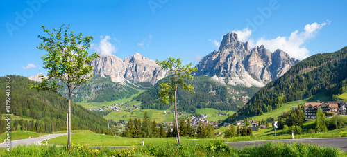Canvas Print Campolongo pass road with view to Corvara tourist resort, Sassongher mountain, d