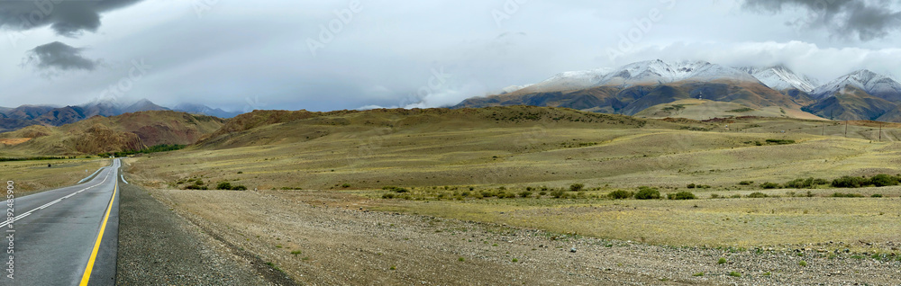 Obraz premium The road goes into the distance in the mountains, a part of the Chuisky tract , Altai, Russia