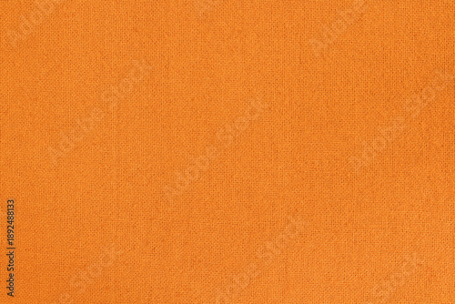 Orange fabric cloth texture for background, natural textile pattern.