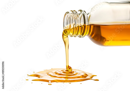Golden honey pouring into glass jar close-up drizzling texture