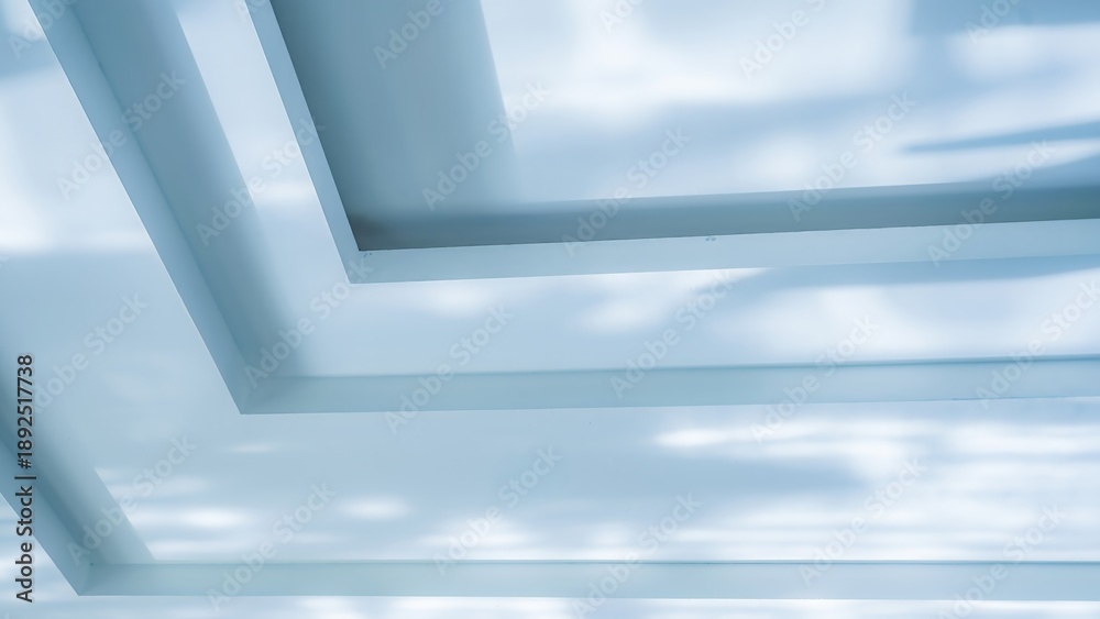 Obraz premium Minimalist geometric ceiling design with soft blue shadows and abstract light play
