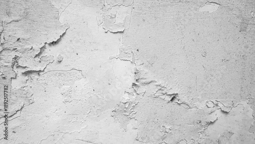 A white wall of a house with peeling paint