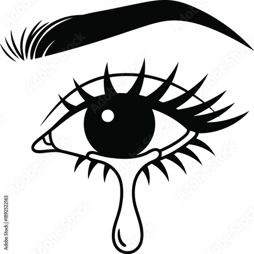 Tear drop falling from a woman's eye