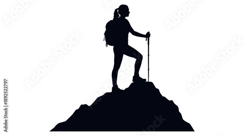 A silhouette of a determined hiker standing triumphantly atop a mountain