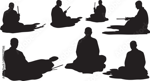 Silhouette of people meditating in various seated positions calmly