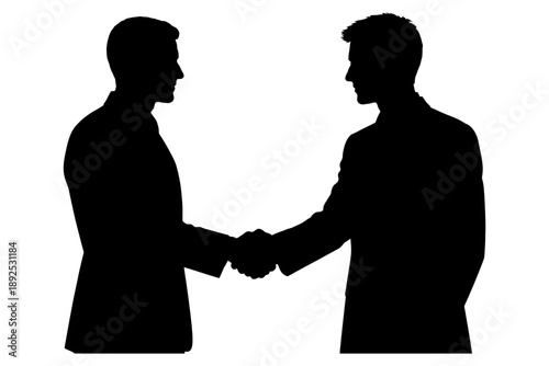 Silhouette of two men shaking hands in business agreement.