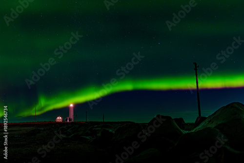 Photos Bright Green Aurora Arc Above Remote Lighthouse At Night