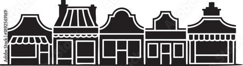 Row of black and white buildings with distinct architectural styles and awnings architecture