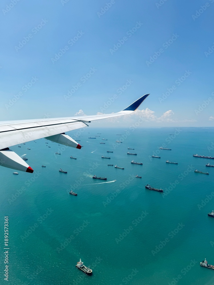 Naklejka premium View from Window of Singapore Airlines A350 with Wing and sea