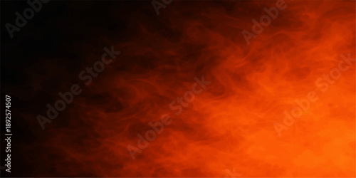 Dramatic burning sunset cloudscape with orange and red flames glowing in the dark night sky creating an abstract nature background of heat and light