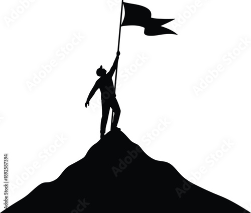 Silhouette of person raising flag on mountain peak