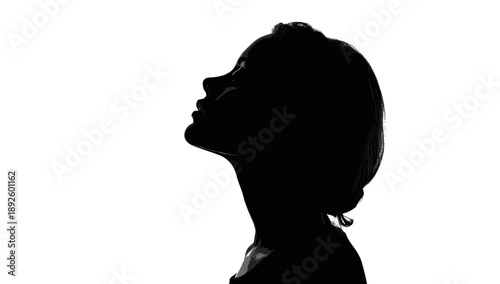 Silhouette of a woman's side profile, head tilted up, on a white background