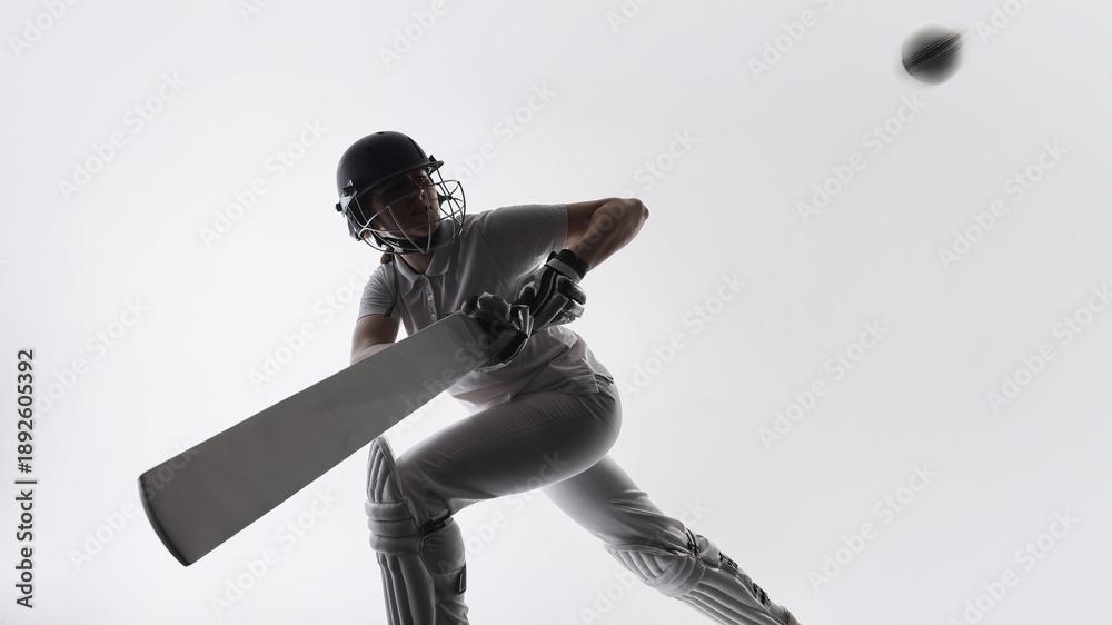 Naklejka premium Cricket player defending ball with bat during match action. Concept of professional sports training, defensive technique, focus under pressure, athletic performance, and competitive gameplay moments.