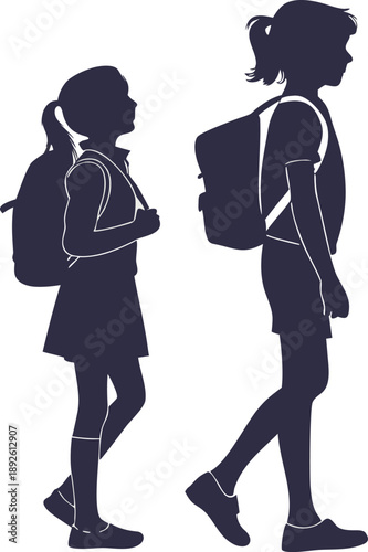 Two students walking with backpacks