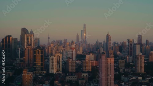 Wallpaper Mural Shanghai Urban Sunset – City timelapse highlighting skyline silhouettes against sunset sky. Torontodigital.ca