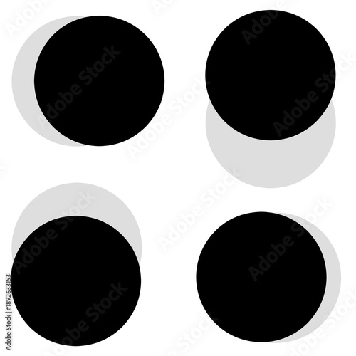 Set of four black circles with soft gray shadows on white background.