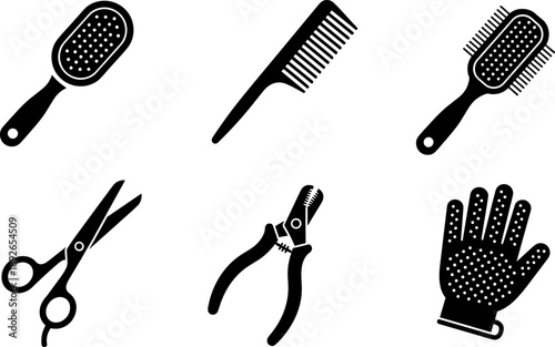 Collection of grooming tools including brushes, comb, scissors, clippers, and grooming glove
