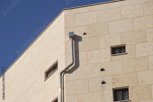 Modern facade with metal pipe and geometric lines