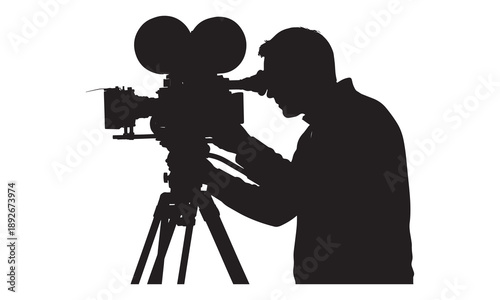 Silhouette of a cameraman using a vintage film camera on a tripod for filming.