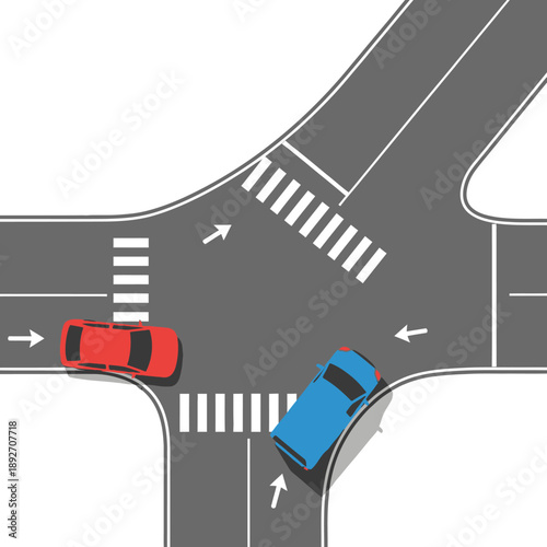 Aerial view of traffic intersection with cars and pedestrian crossings, urban street.