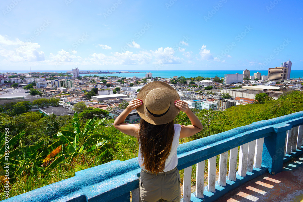 Obraz premium Tourist woman enjoying cityscape of Maceio, Alagoas, Brazil