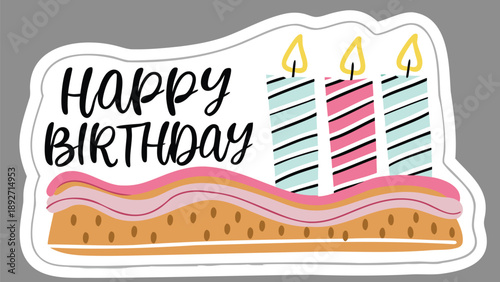 Colorful birthday cake with soft icing textures and three lit candles on top