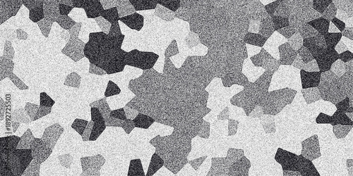 Geometric abstract monochrome mosaic pattern composed of irregular polygonal shapes in varying shades of gray with a fine grain texture overlay