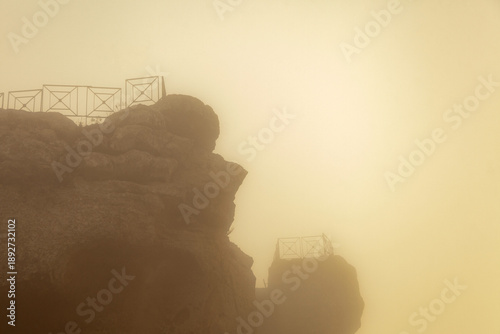 Картината върху платно Rocca di Cerere rock formation shrouded in mist with viewing platforms visible a