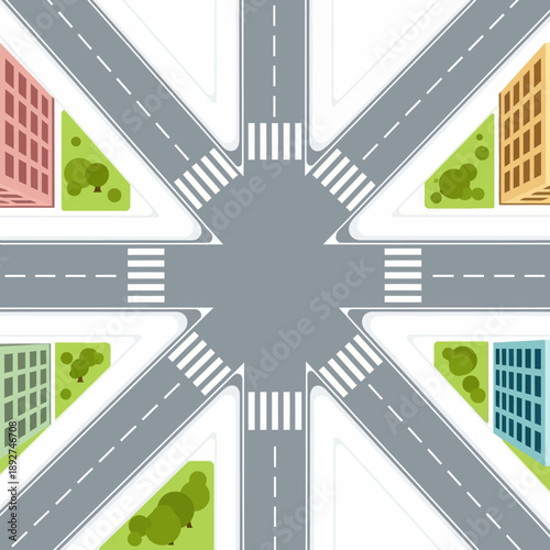 Aerial view of a complex city intersection with crosswalks and buildings