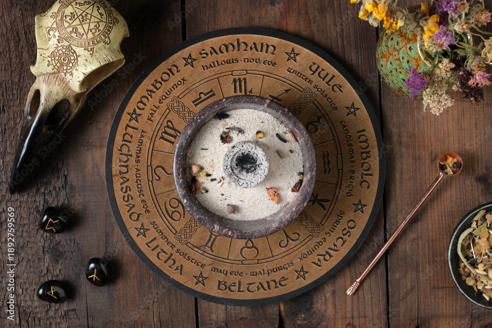 Fototapeta premium Preparation for a Wicca incense ritual with herbs, resins and mystical symbols