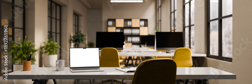Φωτογραφία 3D rendering of a modern open plan office with laptop on working table